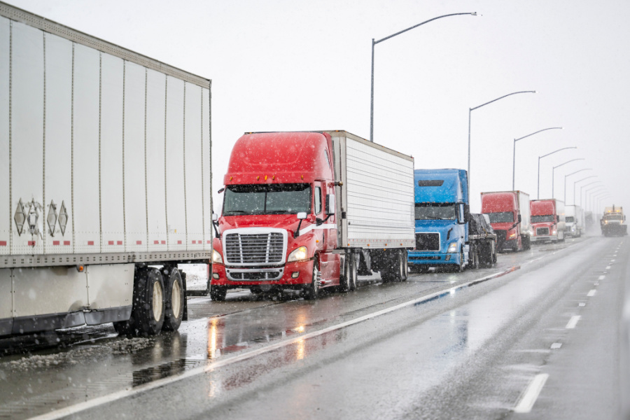 commercial trucks on icy road