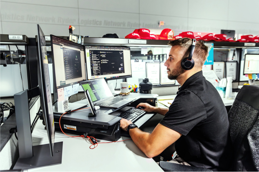 Freight brokerage employee working at desk